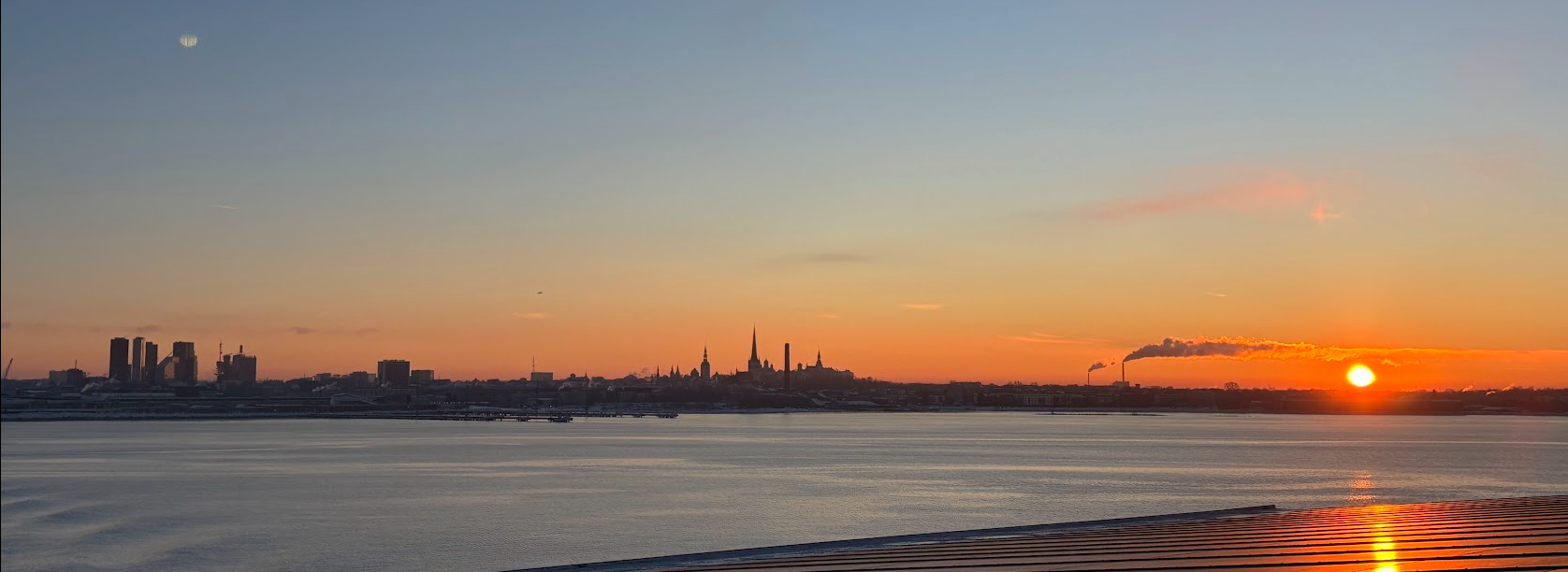 Panoramic view of Tallinn skyline from the sea showing both medieval and modern architecture